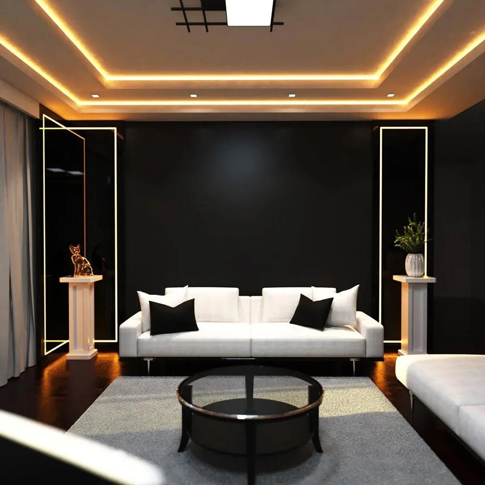 Modern living room with white sofa, black coffee table, and decorative elements.