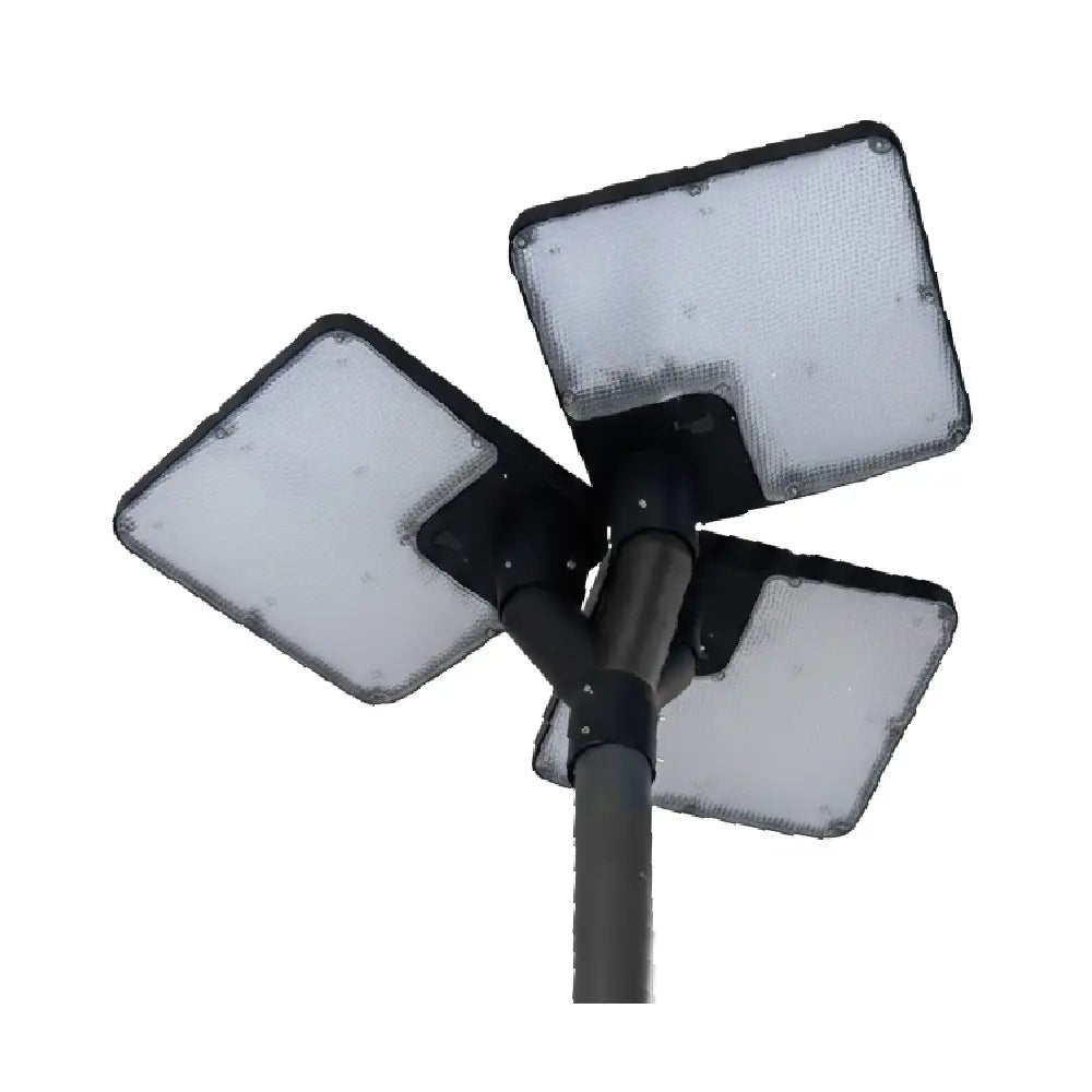 Three square light fixtures on a black pole against a white background