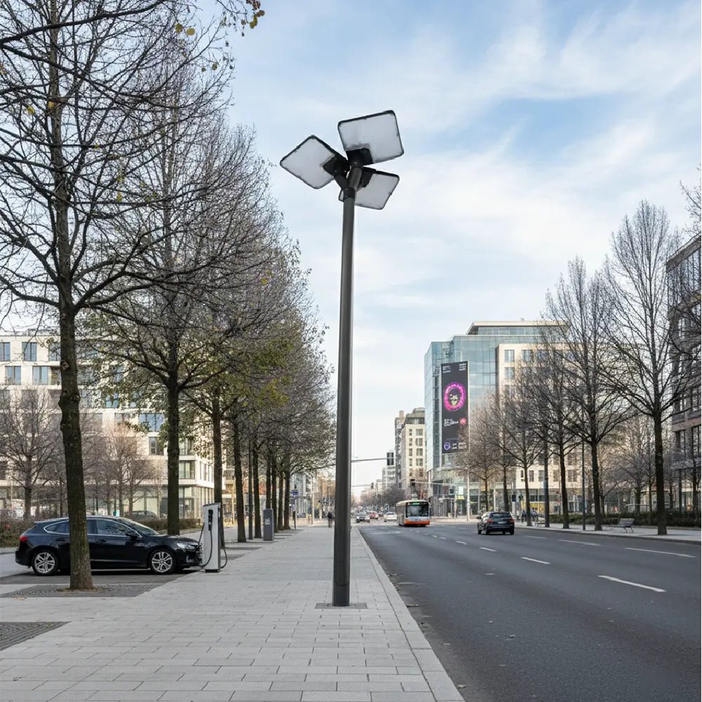 Street scene with a modern streetlight, cars, and buildings in an urban setting.
