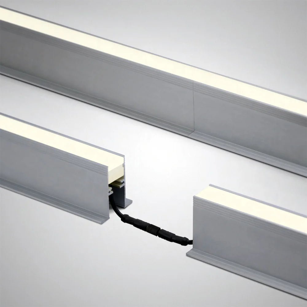 Close-up of LED strip lights with a power cord on a neutral background