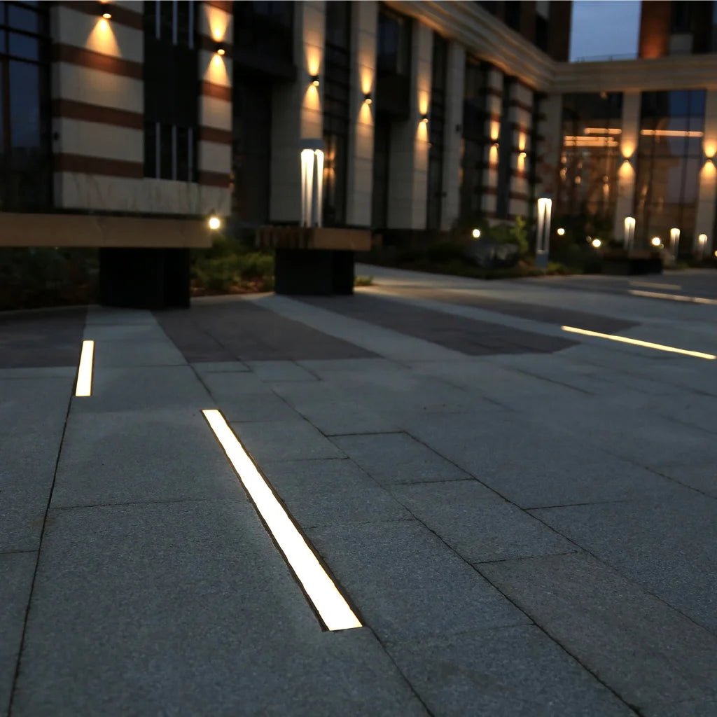 Modern building exterior with illuminated walkway at night