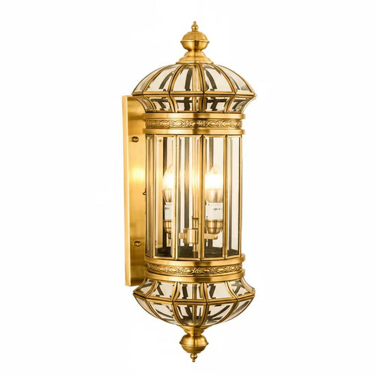 Decorative gold wall-mounted light fixture on a white background