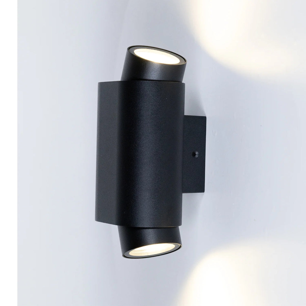 Black outdoor wall light fixture on a white background