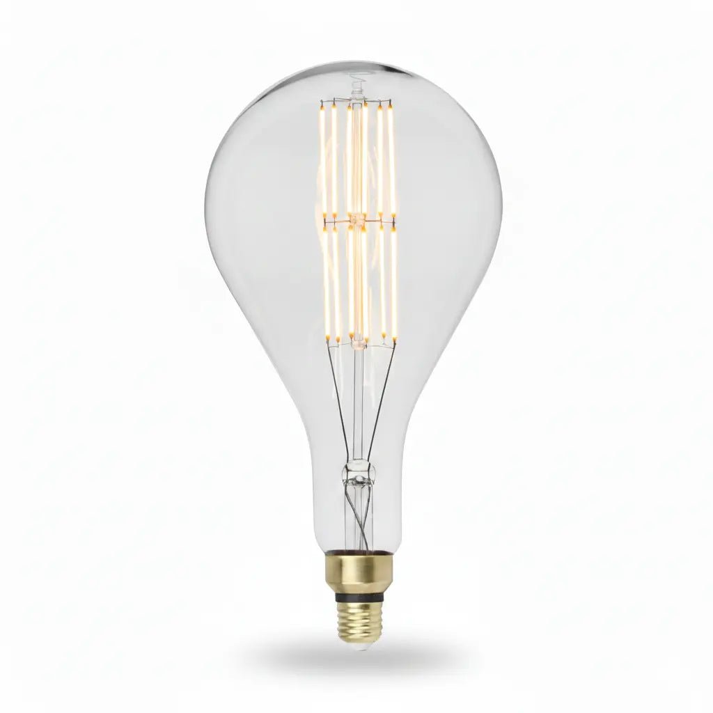 Clear light bulb with visible filament on a white background
