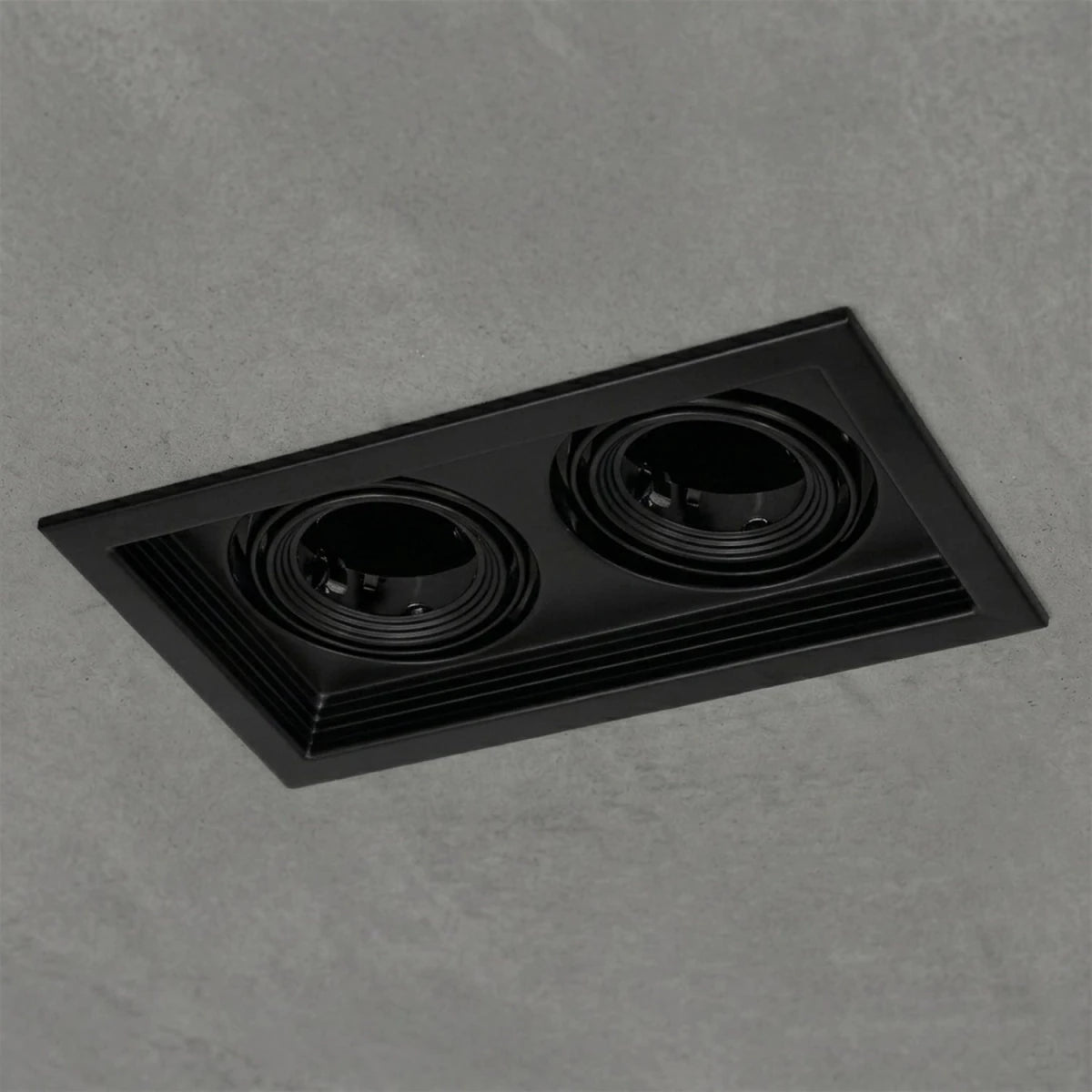 Black recessed ceiling light on a white background