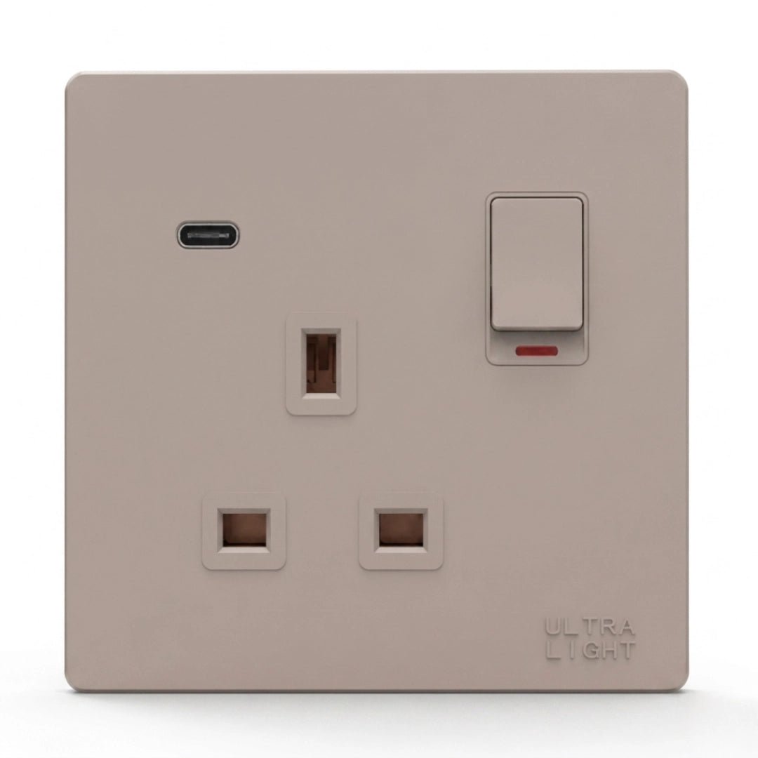 Beige light switch and socket combination on a white background