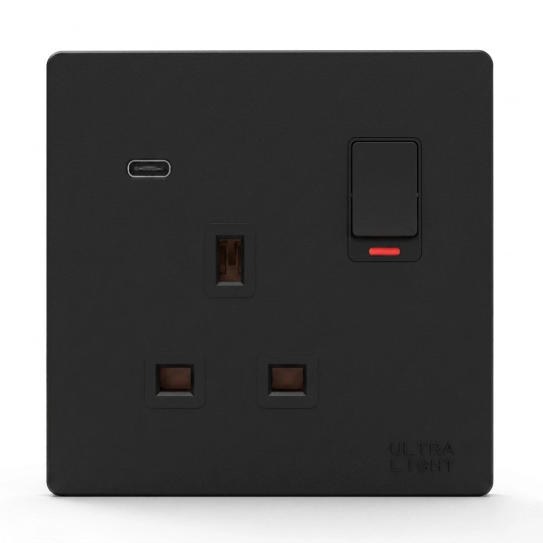 Black electrical socket with a switch on a white background