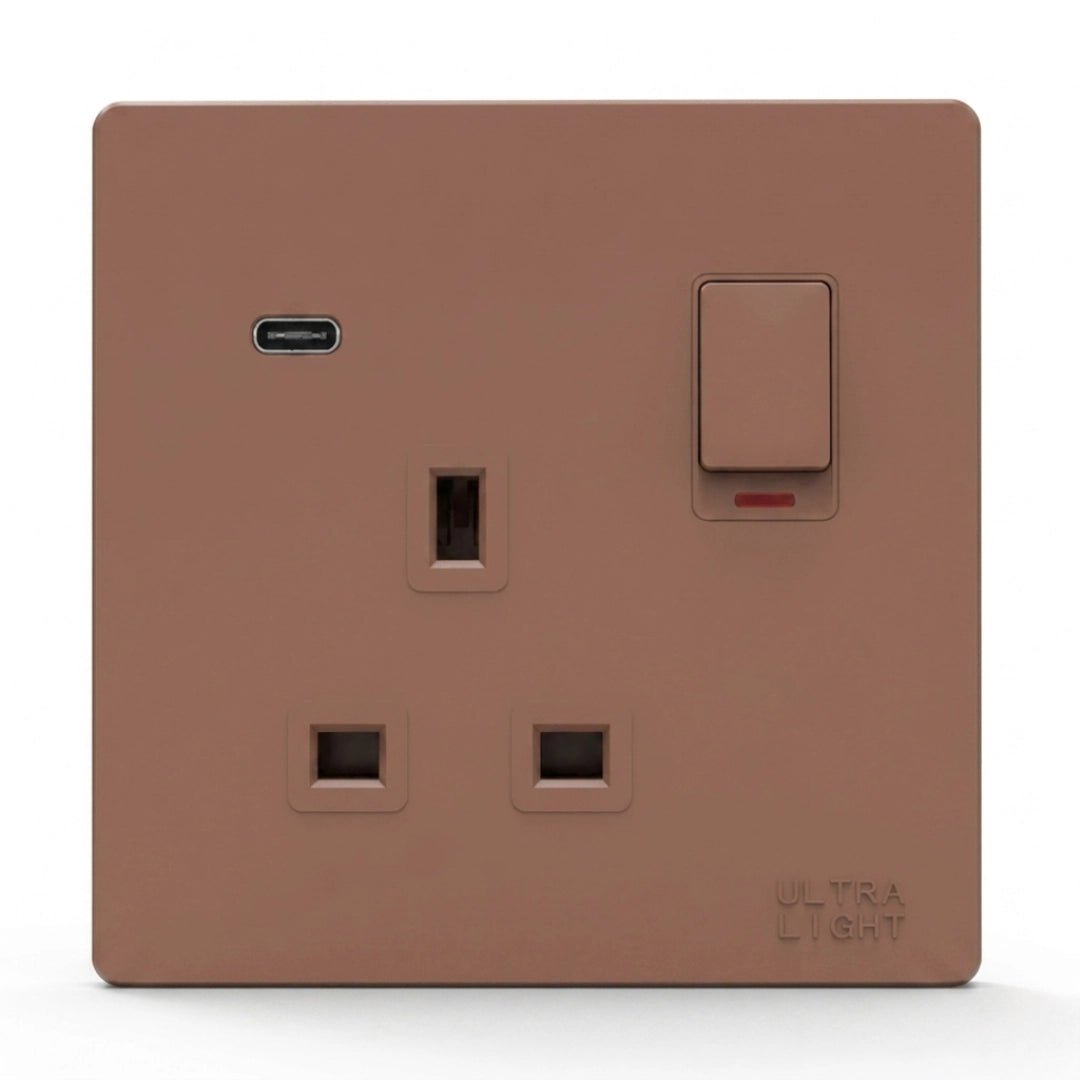 Brown light switch with socket on a white background