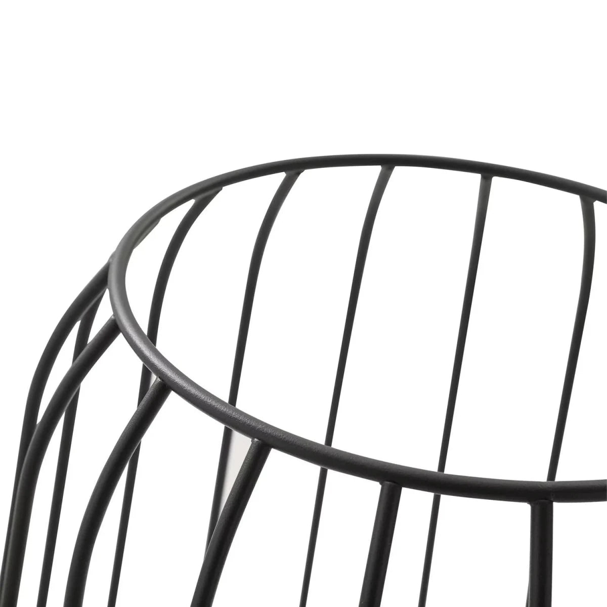 Close-up of a black metal chair frame on a white background