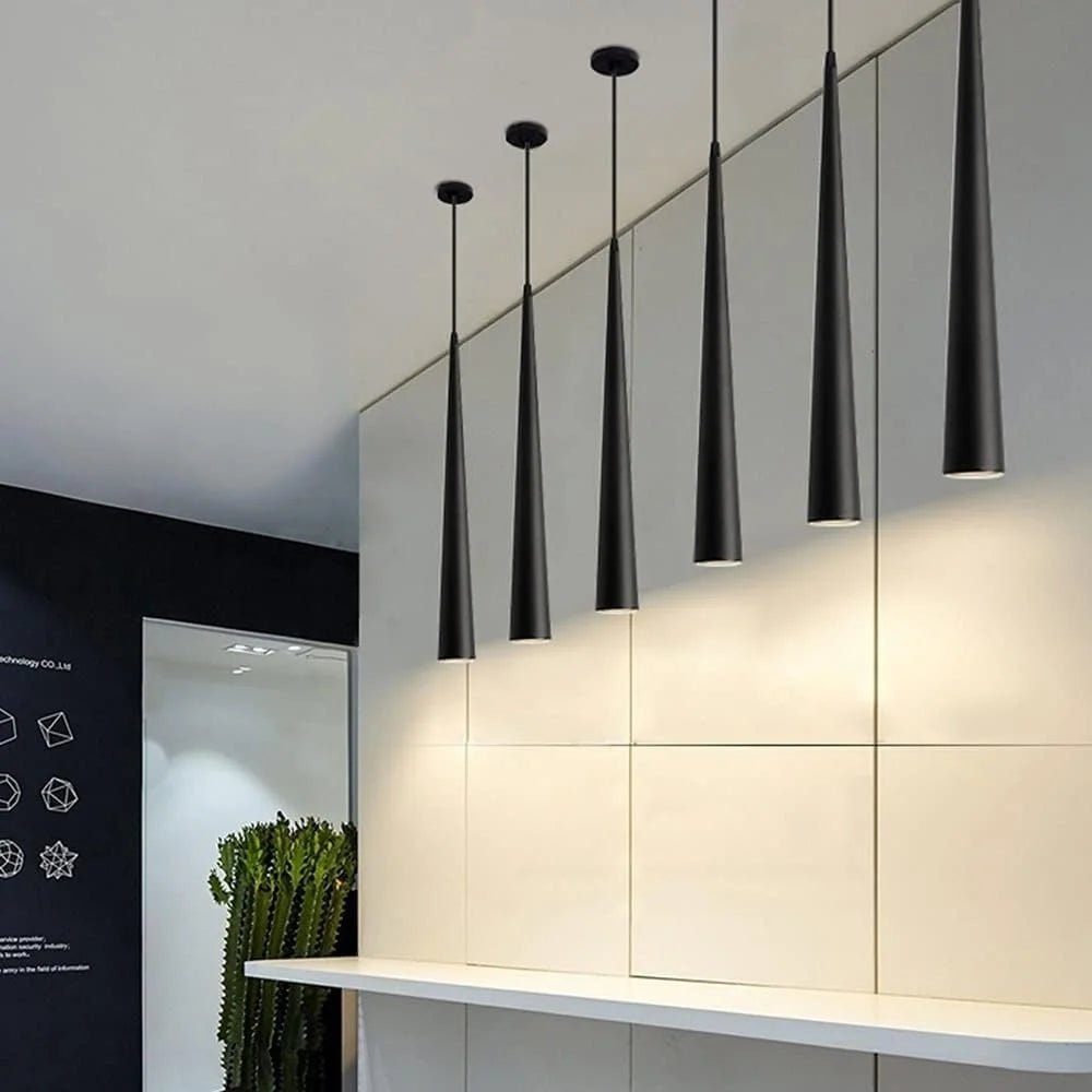 Modern pendant lights hanging in a minimalistic interior setting.