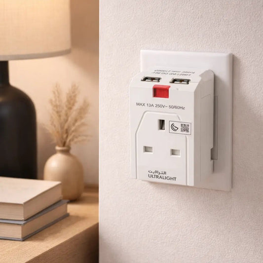 White wall adapter with multiple ports on a light-colored wall.