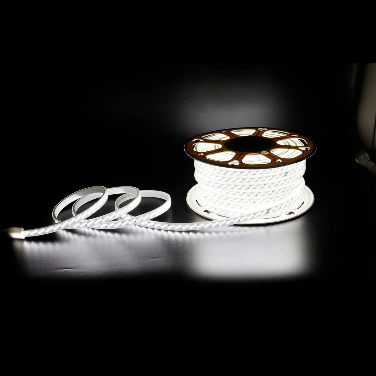 Spool of white rope on a black background