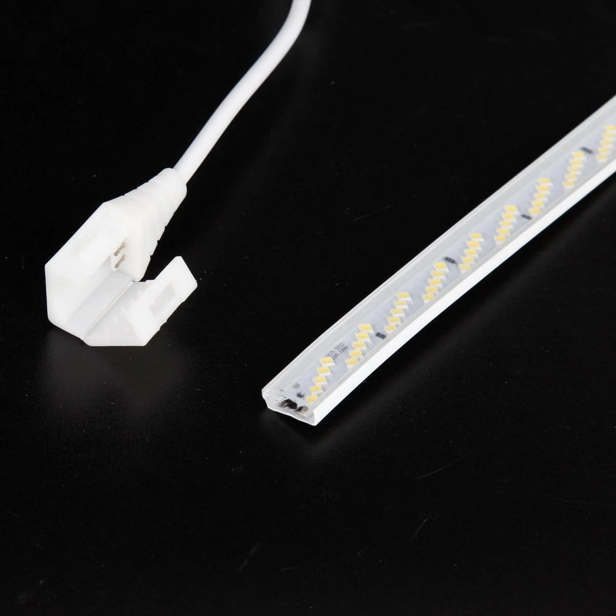 LED strip light with connector on a black background
