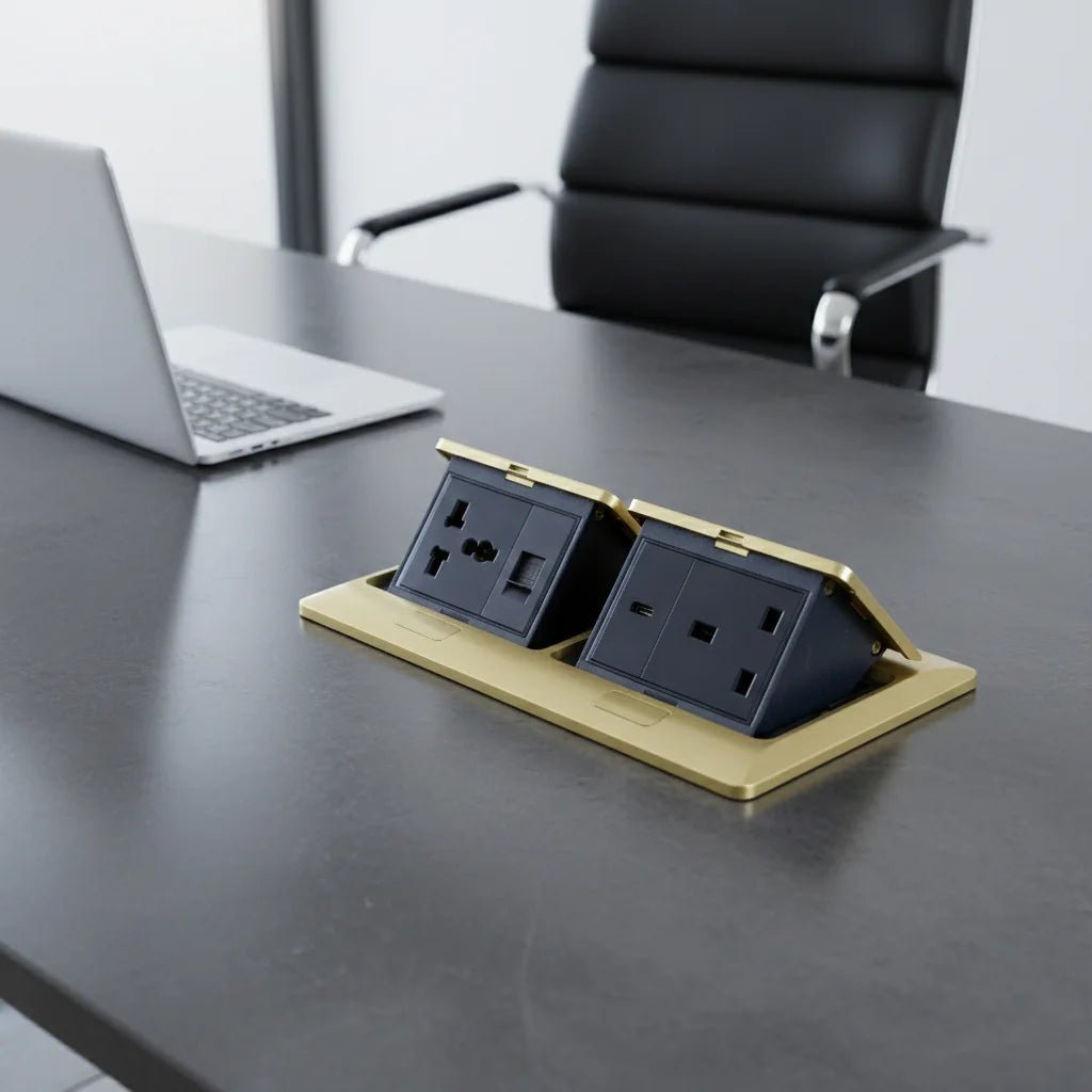 Desk with a power strip and laptop in an office setting