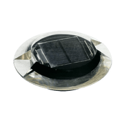 A solar-powered ground embedded light with a visible solar panel on top.