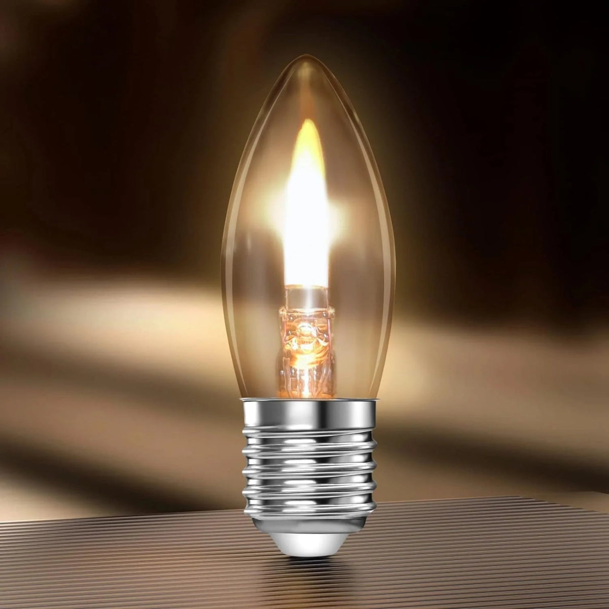 Light bulb with a warm glow on a dark background