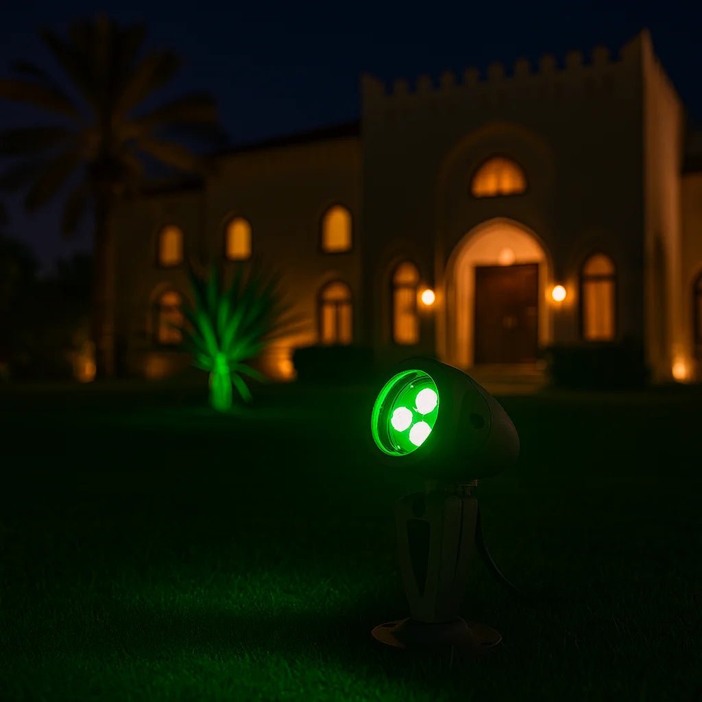 Green laser pointer on grass with a building in the background