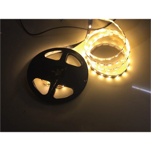 LED light strip with reel on a reflective surface