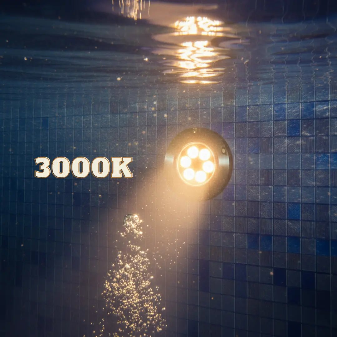 Underwater light fixture with '3000K' text on a tiled pool wall.