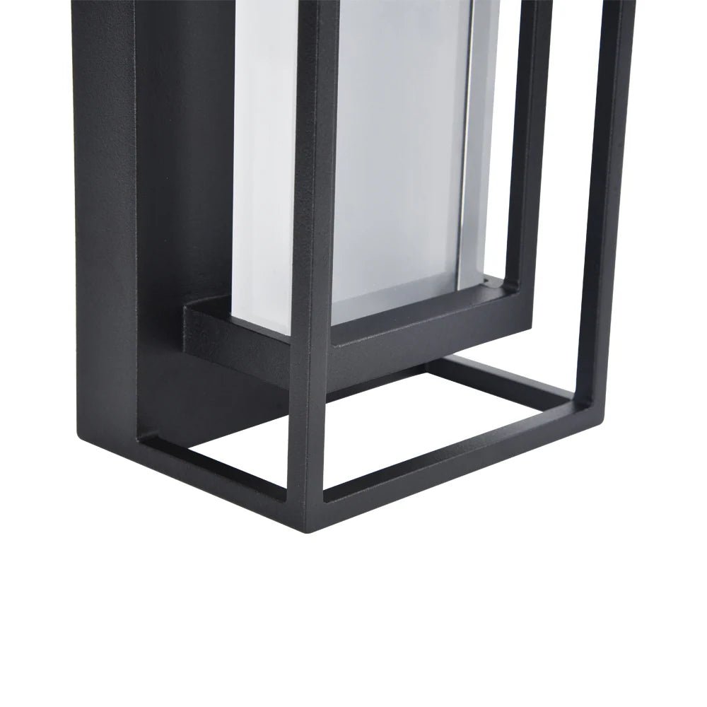 Black metal lantern with glass panel on a white background