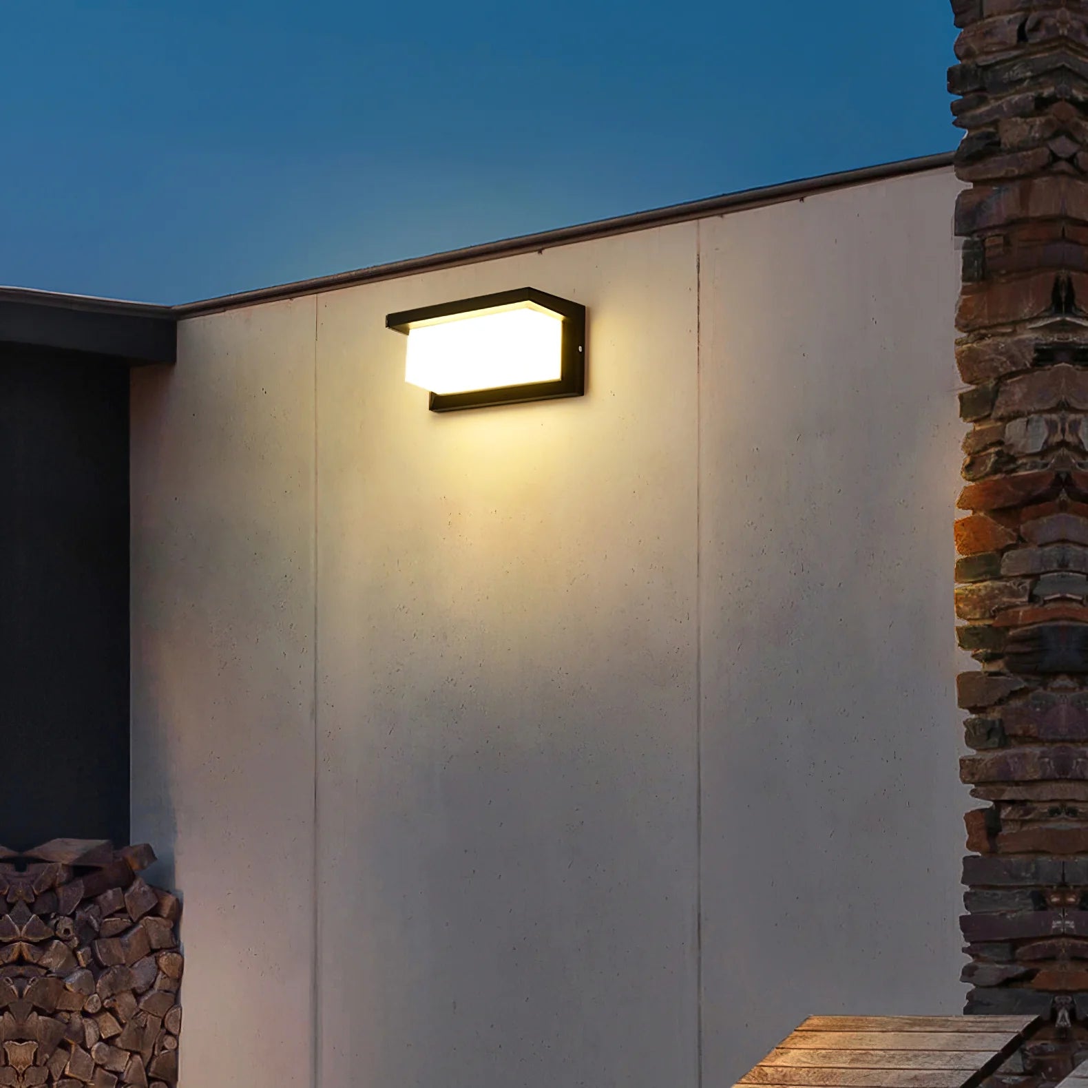 Ultralight LED Wall Sconce (BD3112) mounted outdoors on wall emitting soft, warm light in evening setting.
