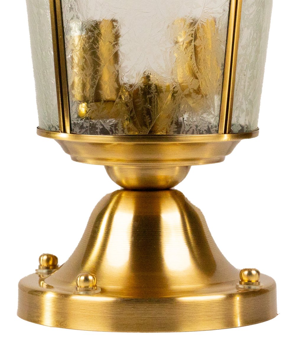 Brass lantern with glass shade on a white background