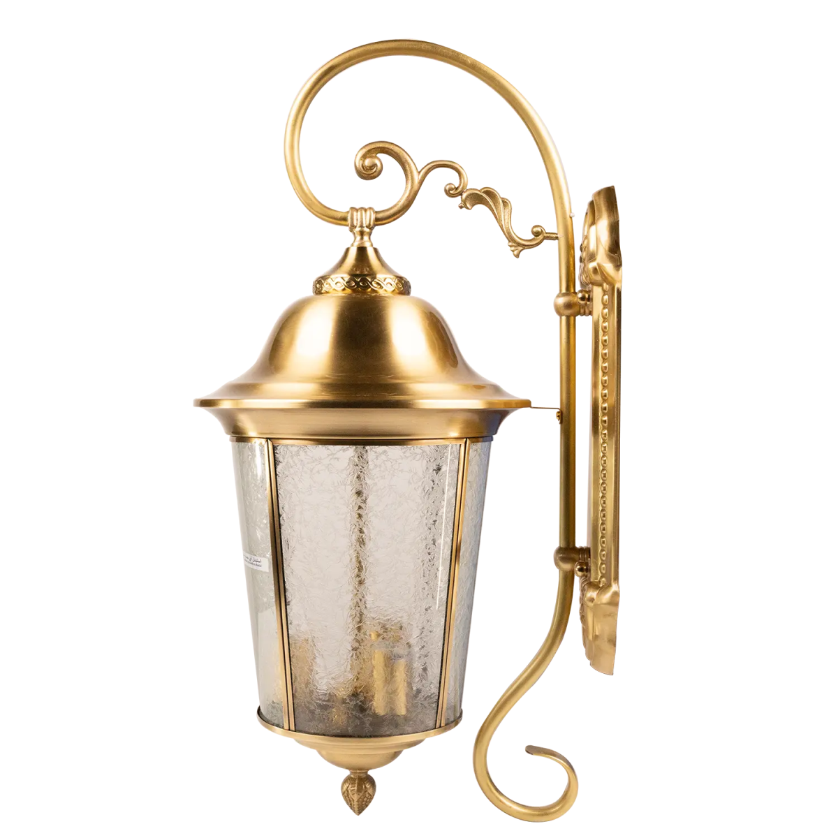 Gold outdoor wall light fixture with decorative design on a white background