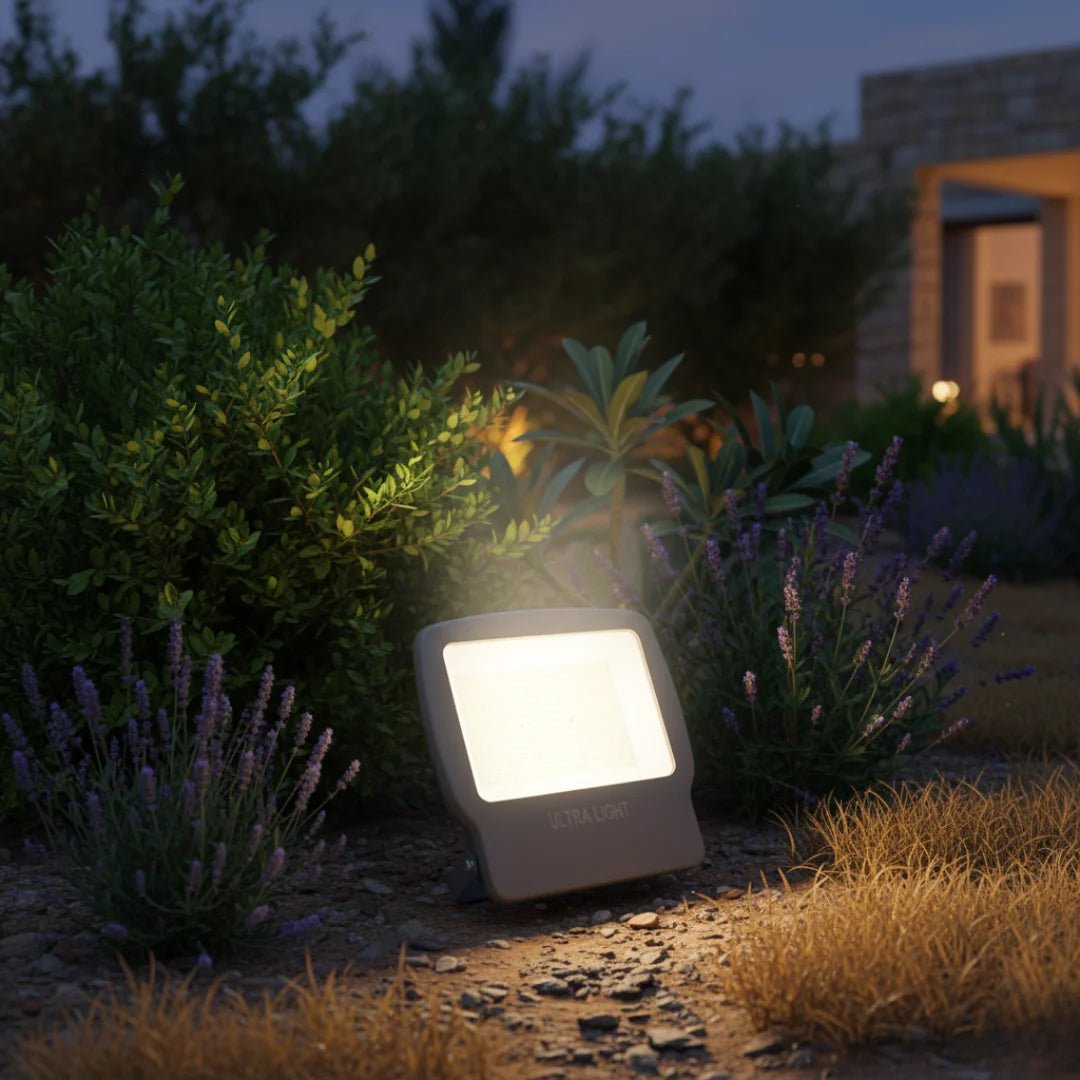 Outdoor flood light illuminating a garden at night