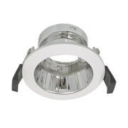 Recessed ceiling light with white housing and clear glass on a green background