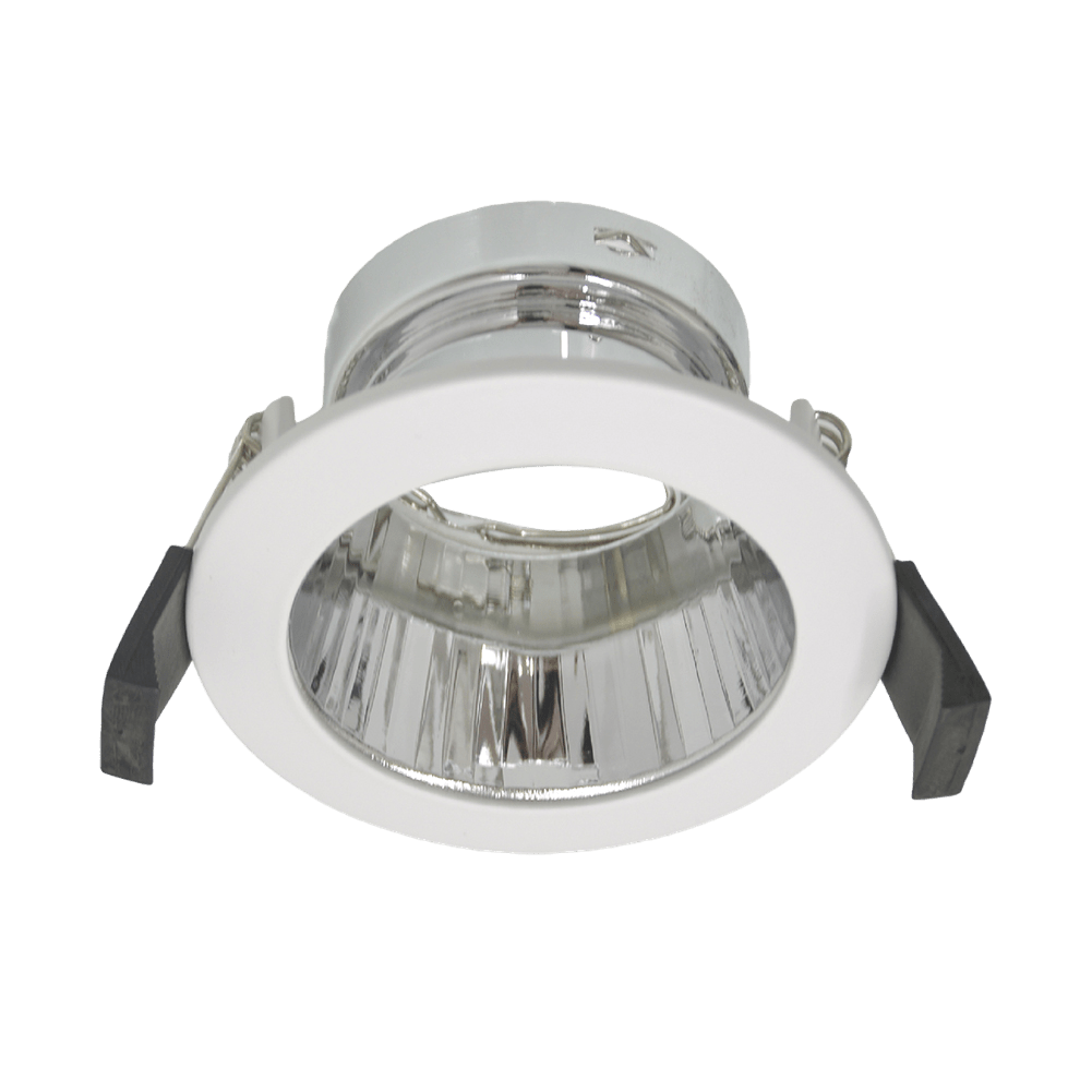 Recessed ceiling light with white housing and clear glass on a green background