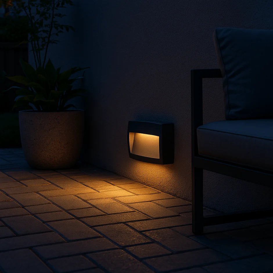 Outdoor light fixture on a patio at night