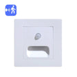 White light switch with motion sensor on a white background