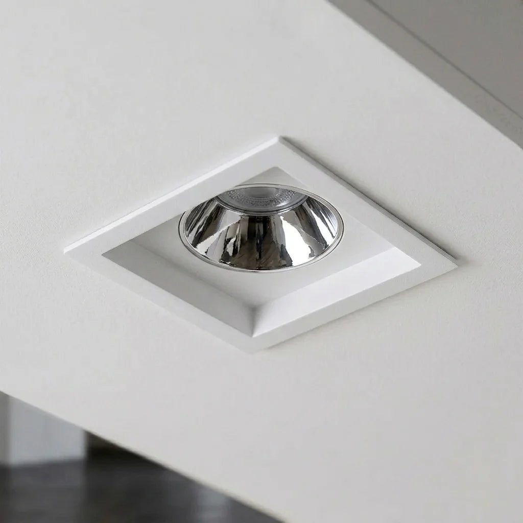 Square recessed ceiling light with chrome finish on a white ceiling