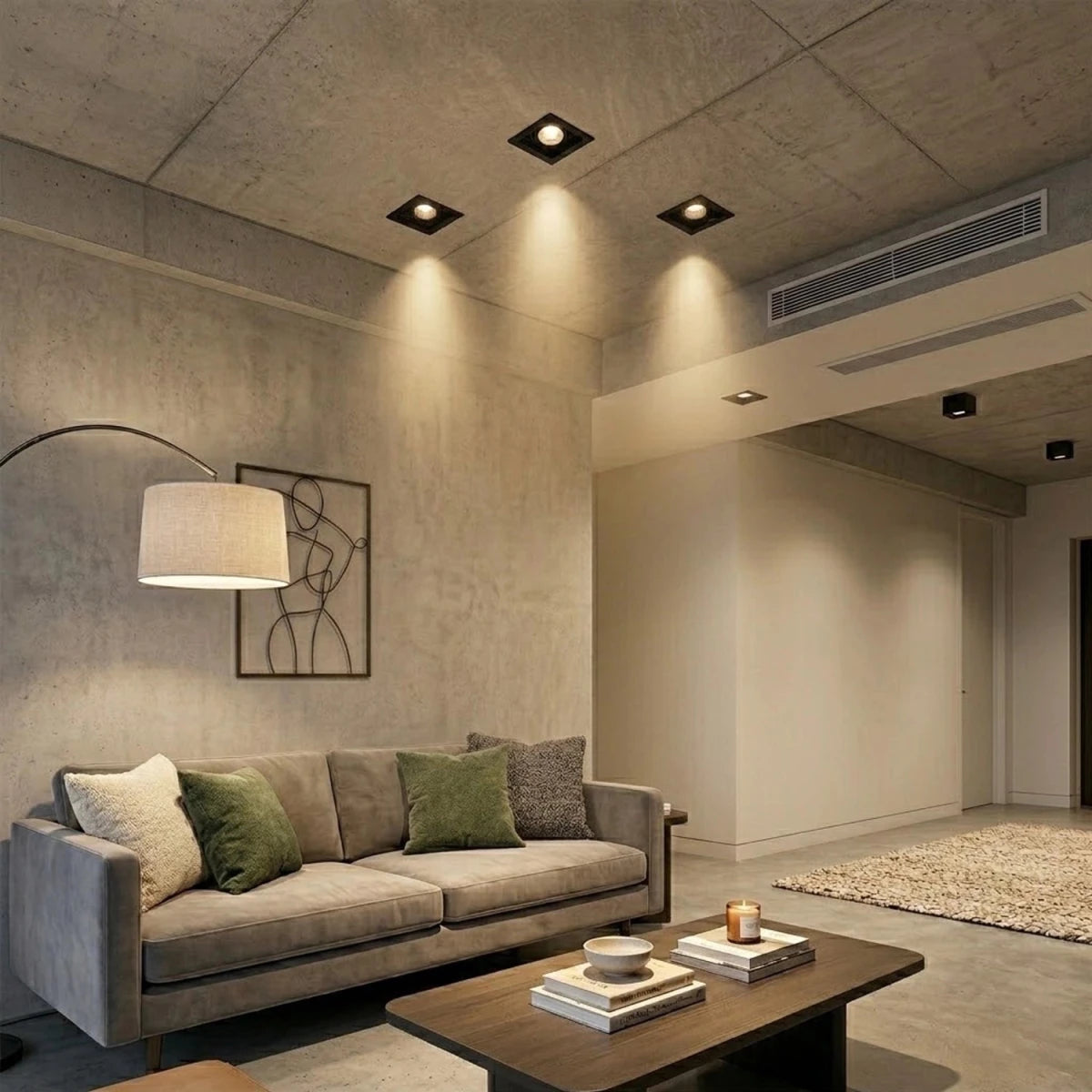 Modern living room with gray sofa, coffee table, and decorative elements.