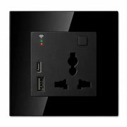 Black wall socket with USB ports and indicator lights on a white background