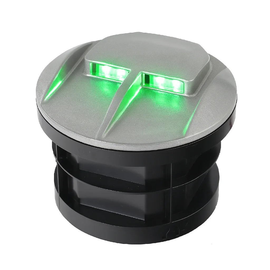 Outdoor light fixture with green LED lights on a white background