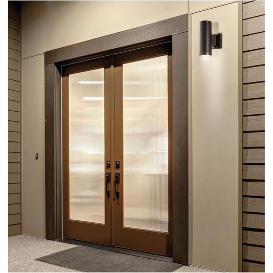Modern glass front door with frosted panels on a house exterior.