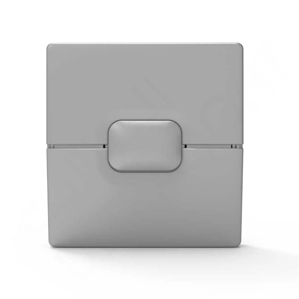Gray electronic device with a rectangular button on a white background