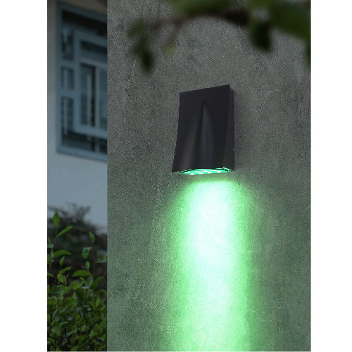 Ultralight LED Wall Light (BDX1006) mounted outdoors, casting bright green light on textured wall at night.