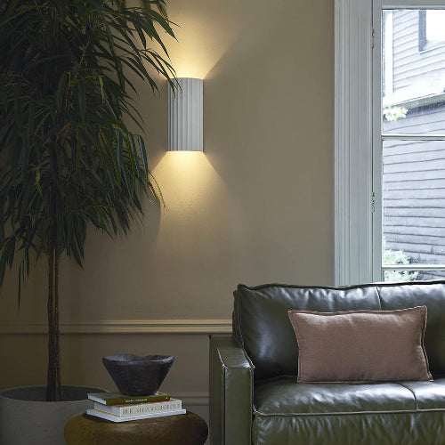 Ultralight Modern Wall Light (TK-G166) illuminating a contemporary living room with soft, elegant wall lighting design.
