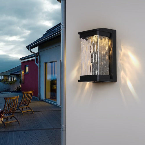 Ultralight Modern Wall Light (ULT-1003) mounted outdoors, showcasing modern design and soft LED illumination on a wall.