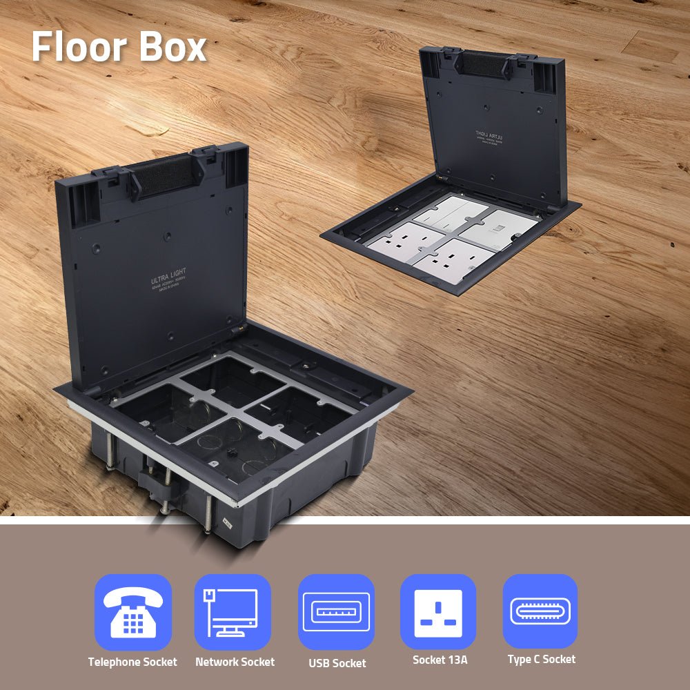 Floor box with open lid showing electrical sockets on a wooden floor.