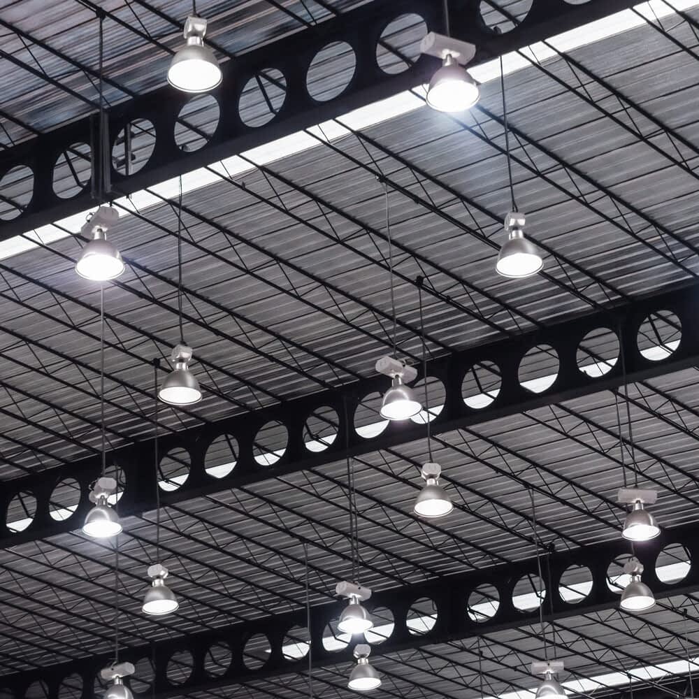Ceiling with hanging light bulbs in a warehouse setting